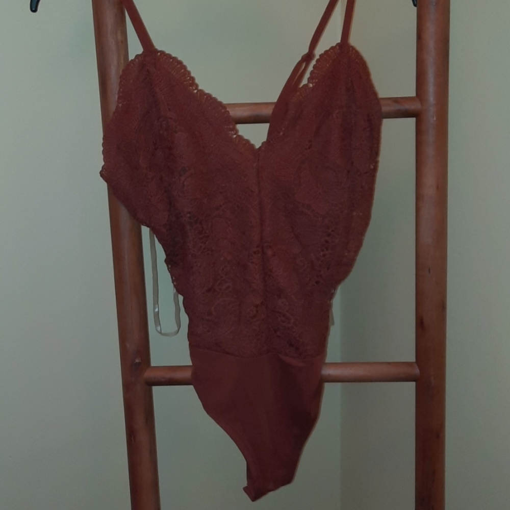 Burnt orange body suit